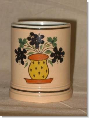 Small SLIP DECORATED AND PAINTED MUG.