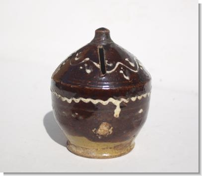 WILTSHIRE SLIPWARE MONEY BOX.