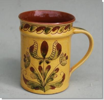 MARY WONDRAUSCH OBE (BRITISH, 1923-2016), A pottery slipware mug