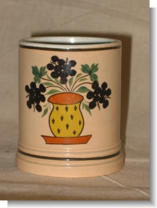 Small SLIP DECORATED AND PAINTED MUG.