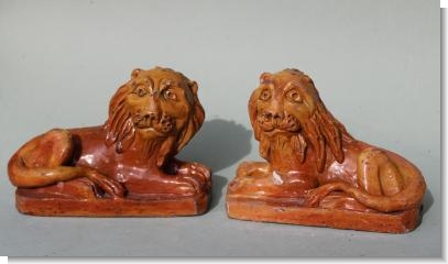 PAIR OF PILL POTTERY LIONS , South Wales 1830