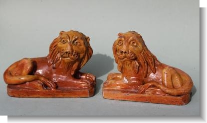 PAIR OF PILL POTTERY LIONS , South Wales 1830